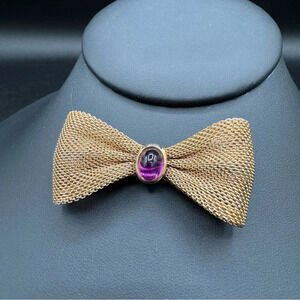 Bow Tie Pin with Purple Lucite Cabochon Jewel in Gold Tone Mesh